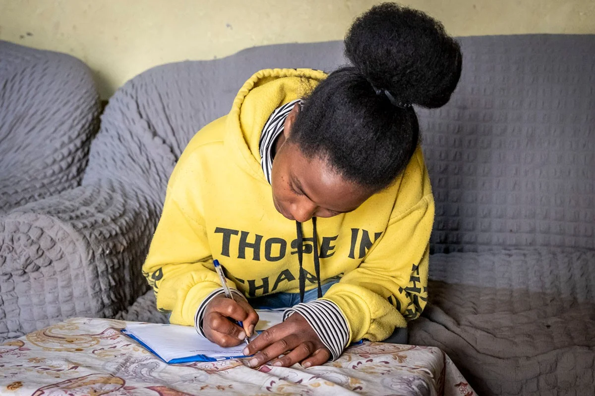 Girl writes in her diary