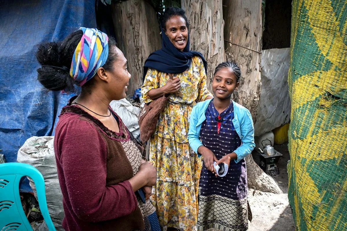 Social worker from Debre Berhan, Ethiopia | Menschen für Menschen Foundation Social worker Martha talks to Tebka and her mother