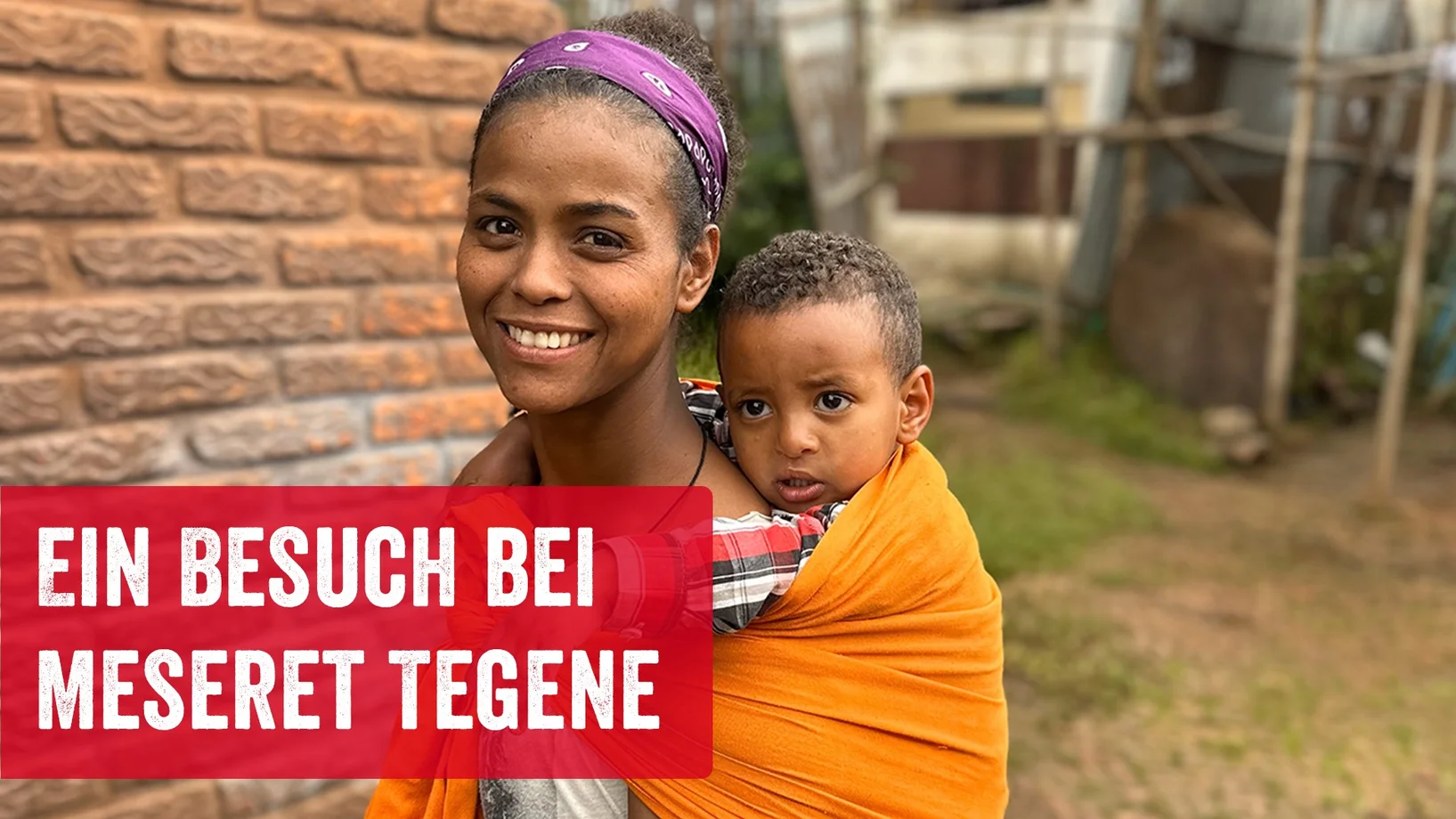 Mutter mit Kind auf den Rücken und Schriftzug "Ein Besuch bei Meseret Tegene"